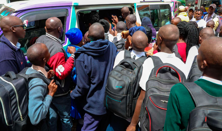 School children scrambling for a matatu.